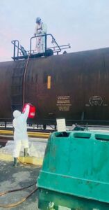 CRMS partner working on railcar cleaning